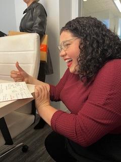 A Trial Pro team member reviewing an Angel Tree wish list.